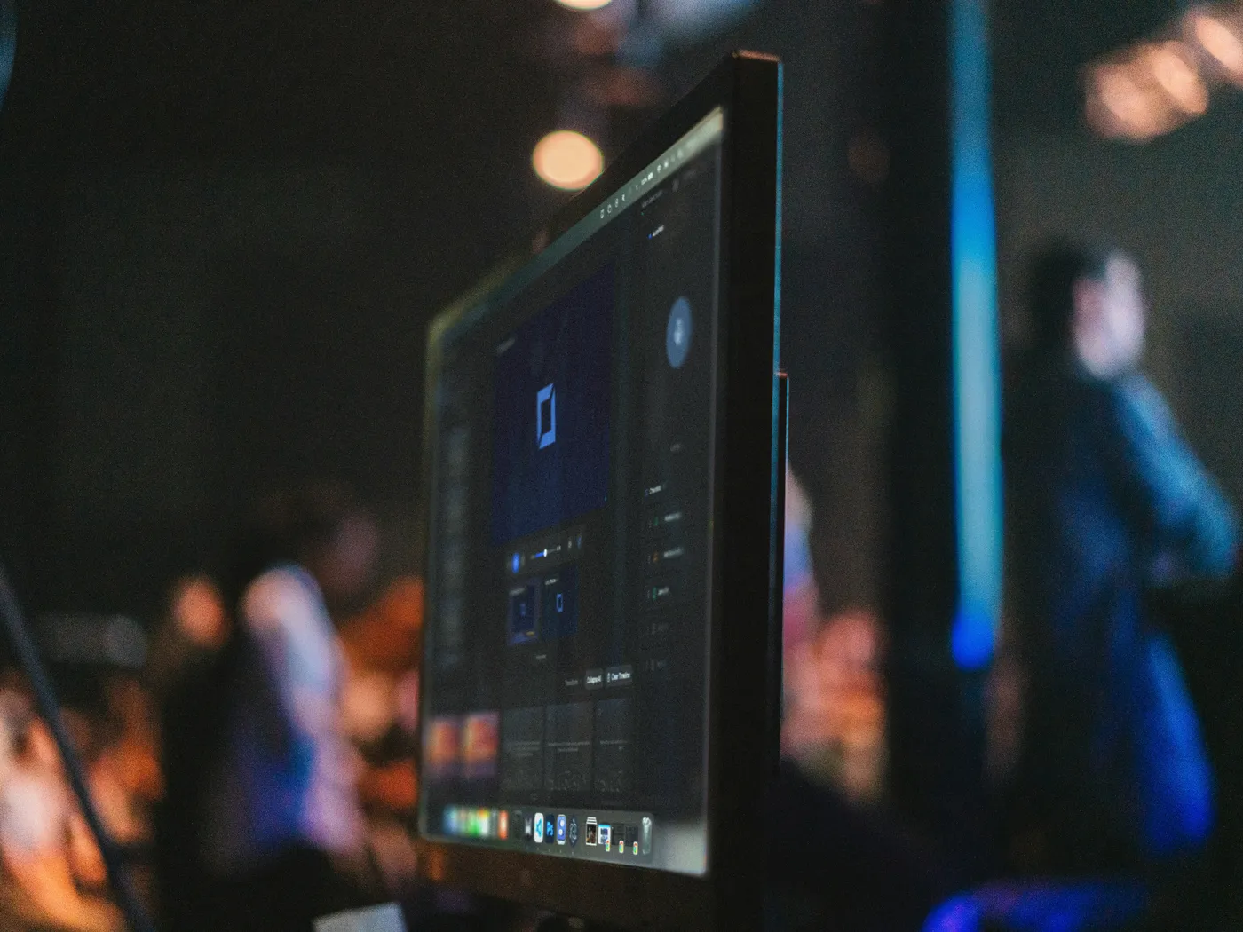 A church computer screen running Verse Copilot, with the congregation and stage lights behind it
